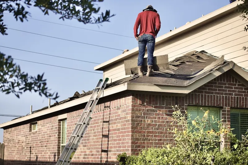 Professional roofer working on a residential roof in Downtown Long Beach